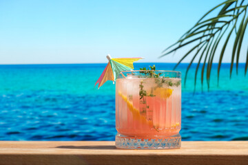 Hard seltzer grapefruit and thyme cocktail at beach bar.