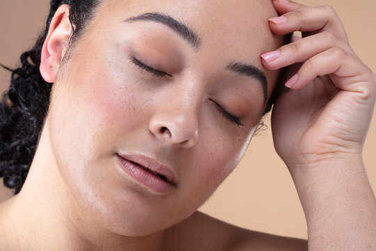 Studio shot woman with eyes closed