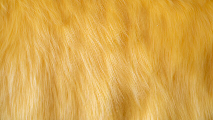 Yellow long pile plush texture.  Fabric texture. Close up.