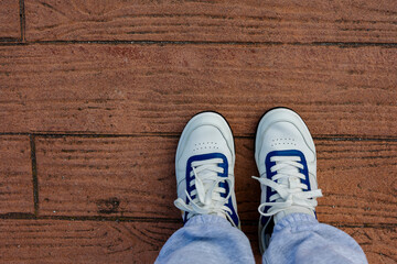 A pair of white sneakers top-down view