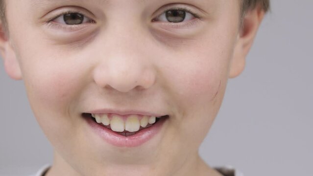 Caucasian boy of 9 years expresses unsatisfaction with a smell in the room.