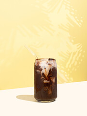 Natural cold cocoa drink with non-dairy milk on a yellow isometric diagonal projection background....