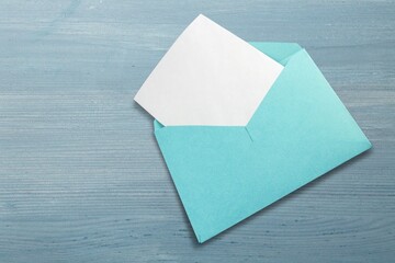 Photography Mockup or White Card in colored envelope on the desk
