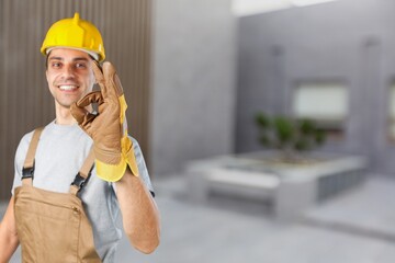 Happy young engineer or repairman showing sign or hand gesture. Concept of professional,