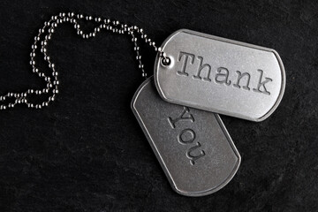 Old and worn military dog tags - Thank You