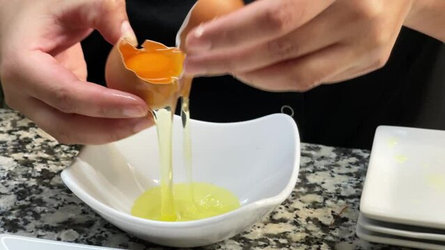 Separating the yolks from the whites.