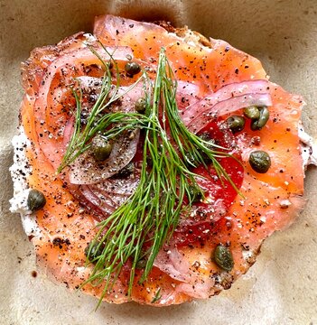 Close up of smoked salmon, capers and cream cheese on a bagel