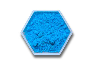 Copper(II) sulfate in hexagonal molecular shaped container on white background.
