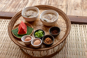 Two cups of boiled rice with seasonings and eggs and watermelon