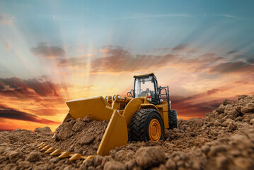 Selective focus with bucket,Wheel loader are digging the soil in the construction site on the...