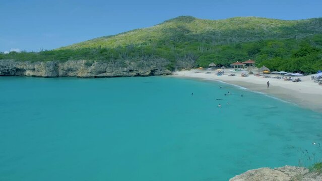 View of the white beach Grote Knip, Curacao, Netherlands with a blue ocean Curacao Caribbean Island tropical beach with palm trees