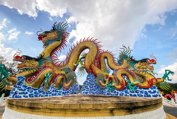 Fototapeta premium Golden dancing Dragon in Suan Sawan, or Paradise Park in Nakhon Sawan, Thailand