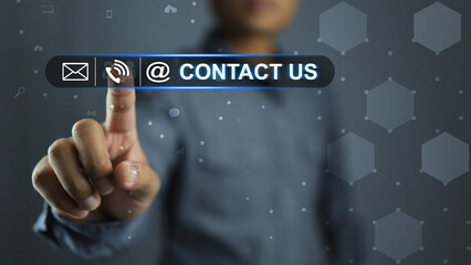 Businessman reaches out to touch click press the contact us an icon in the service and business...