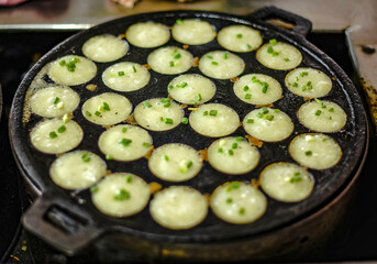 Khanom Krok, an ancient dessert that is commonly sold in Thailand. - obrazy, fototapety, plakaty