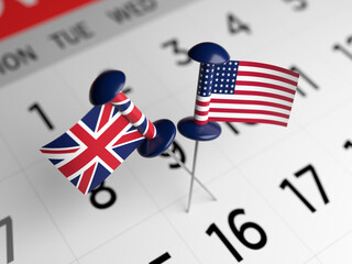 English and American flags are pinned on a white-colored calendar page. Horizontal composition. Focused image.