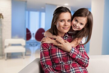 Cute little girl with mom. Happy loving mother and kid enjoying being friendship