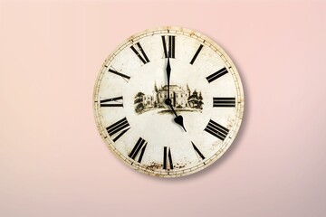 Round clock on pastel background. Wall clock over pink background.