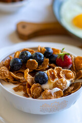 Muesli with honey and berries. Breakfast with strawberries and blueberries. Beautiful tasty breakfast. Breakfast on the table. Dinner. Food day. Breakfast on the table top view.Food on the table top 