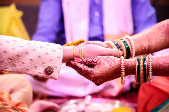 An Indian Couple Holding Hands During A Ritual Of Typical Hindu Marathi Wedding Ceremony