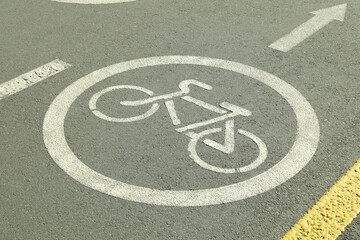 Bicycle lane sign on the asphalt road