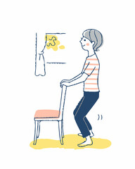 椅子を使って屈伸運動をする女性