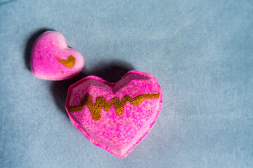 Pink candy heart on blu background 