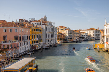 View on Grand Canal with vaporetto and gondolas in Venice. Venetian water transportation concept....