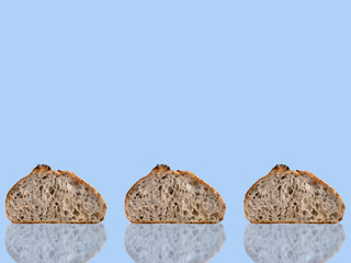 Background arts design three 3 slice homemade sourdough bread with reflect, blue color background, blank for copy space for ads and sale
