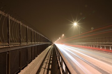 Fototapeta na wymiar traffic on the bridge in the city of tromso norway