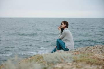 beautiful woman long hair nature rocks coast landscape female relaxing