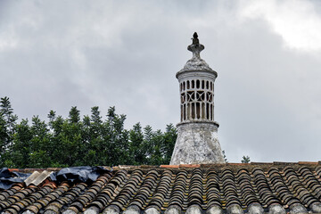 Traditional openwork chimney on a roof in Almancil, Algarve, Portugal - obrazy, fototapety, plakaty