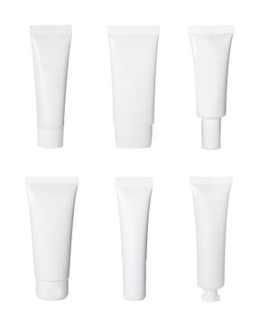 Set with blank tubes of cosmetic products on white background. Mockup for design