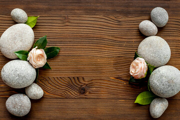 Relax composition with spa stones and pink roses