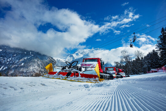 Group of snow groomers - snowcat ratracks machine at Alps resort