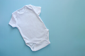 Mockup Flat Lay white bodysuit for on a blue background. Layout for the design and placement of...