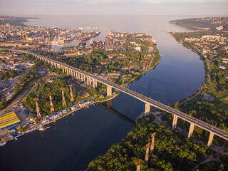 Aerial panorama drone view of Asparuhov bridge and Varna city at sunset