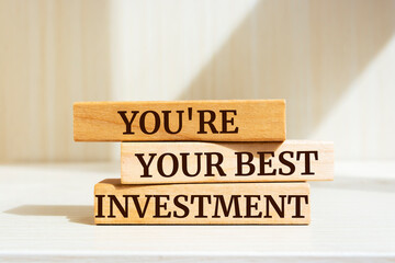 Wooden blocks with words 'You're your best investment'.