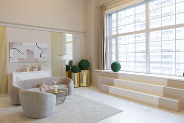 the latest fashion home trends in an ultra modern elegant interior of a cozy studio in soft pastel colors. close-ups of a stylish living area with golden elements