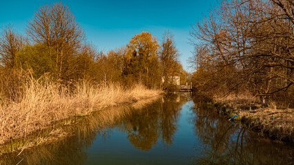 Beautiful spring view with reflections at Infohaus Isarmuendung, Moos, Bavaria, Germany