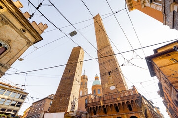View on famous Asinelli towers in Bologna city during sunny weather. Visiting famous landmarks in...
