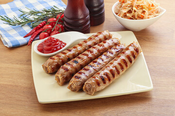 Grilled sausages with cabbage and sauce