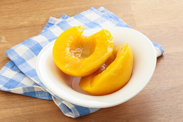 Sweet canned peaches with syrope
