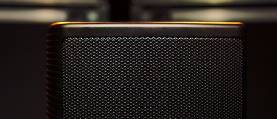 Close-up of a sound column against the background of boxes with concert equipment