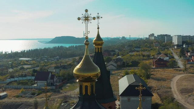 Church of the Archangel Michael in the Left Bank district of the city on an summer day. Flight over the city in peacetime. Ukrainian city before Russian aggression. Ukraine. Mariupol. Opened in 1997.