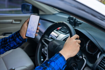 Young Man Using GPS Service Navigation App On Smartphone While Driving Car, Checking Route To Final...