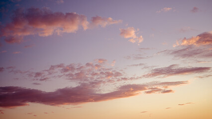 Sunset clouds vanilla color. Natural background.