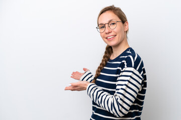 Young caucasian woman isolated on white background extending hands to the side for inviting to come