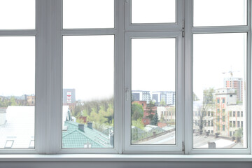 Fototapeta premium Stylish window with white frame in office
