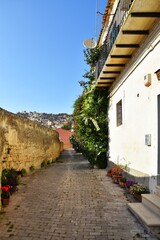Fototapeta na wymiar A narrow street of Modica, an old town of Sicily region, Italy.