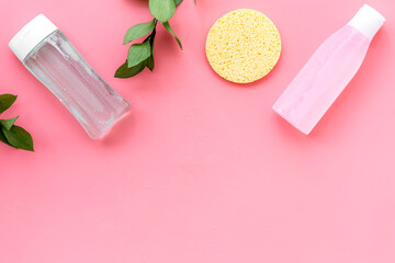 facial tonic, lotion and sponge for face care and plant on pink background top view mock up - obrazy, fototapety, plakaty